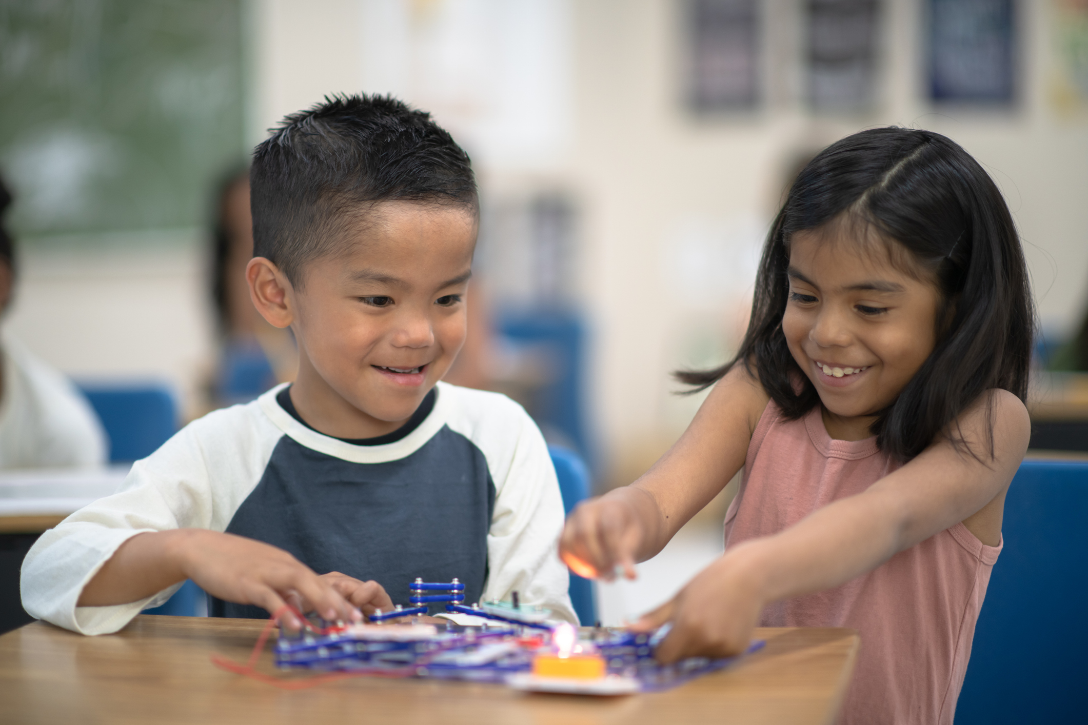 Children experiment with materials.