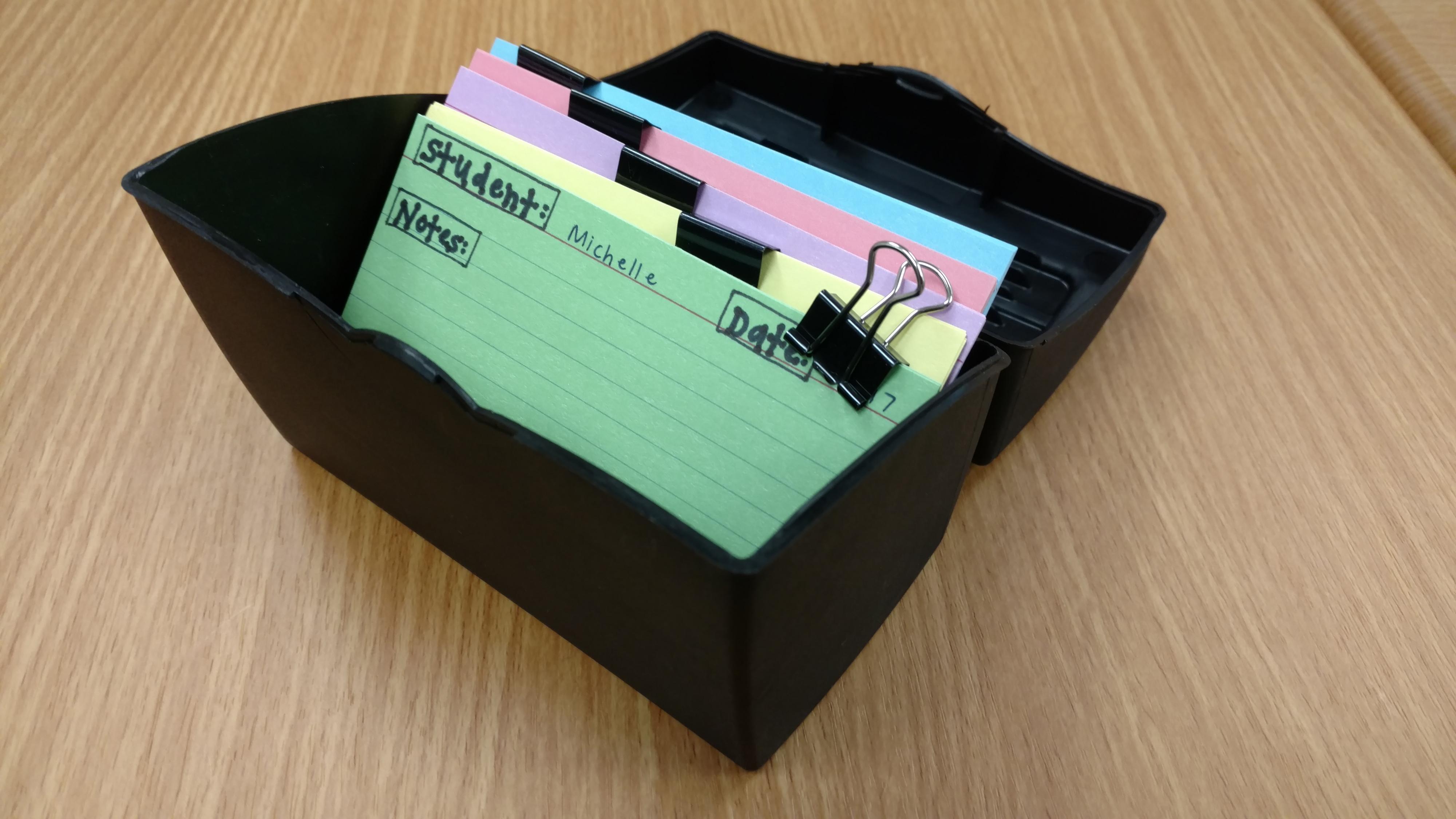 Colored index cards held together with binder clips