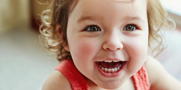 Toddler girl laughing