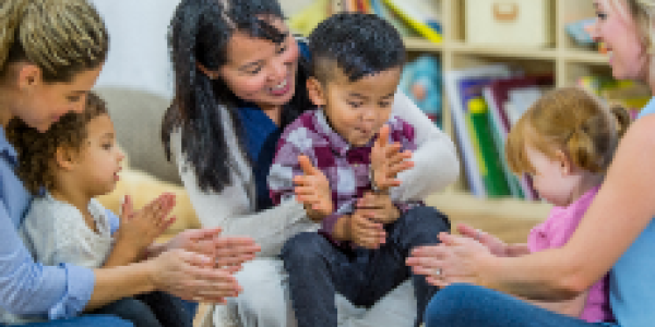 parents clapping along with children