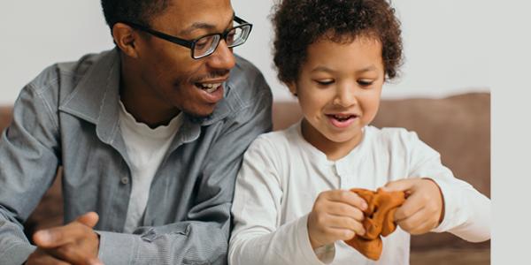 Father and son playing with playdough