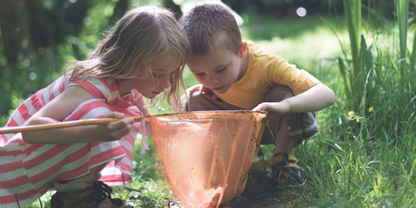 Two children playing outdoors