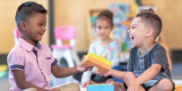 two children playing with blocks