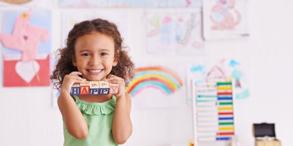 Preschooler holding blocks