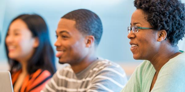 Adults engaging in learning