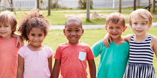 Children standing outdoors.