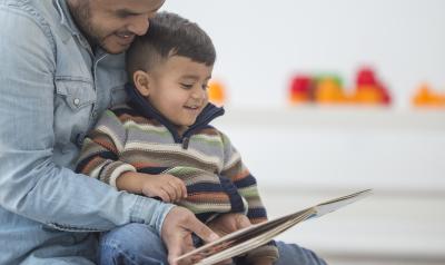 a dad reading to a child