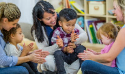 parents clapping along with children