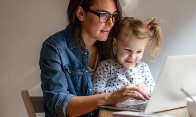 Mother and daughter looking at a digital tablet