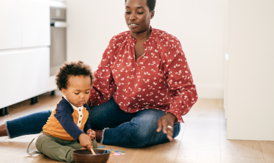 a teacher supervising a child playing