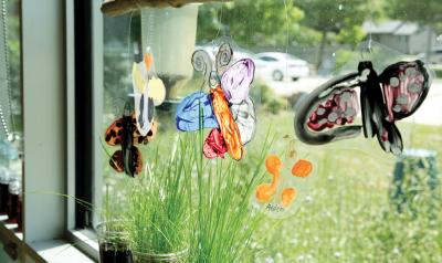 butterfly sculptures hanging in window