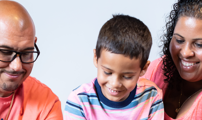 parents reading with a child