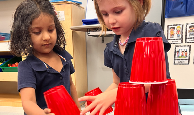 children constructing with plastic cups