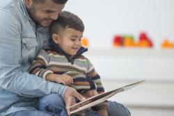 a dad reading to a child