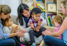 parents clapping along with children