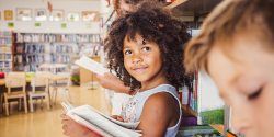 a young girl with a book