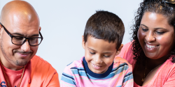 parents reading with a child