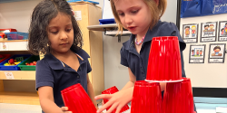 children constructing with plastic cups